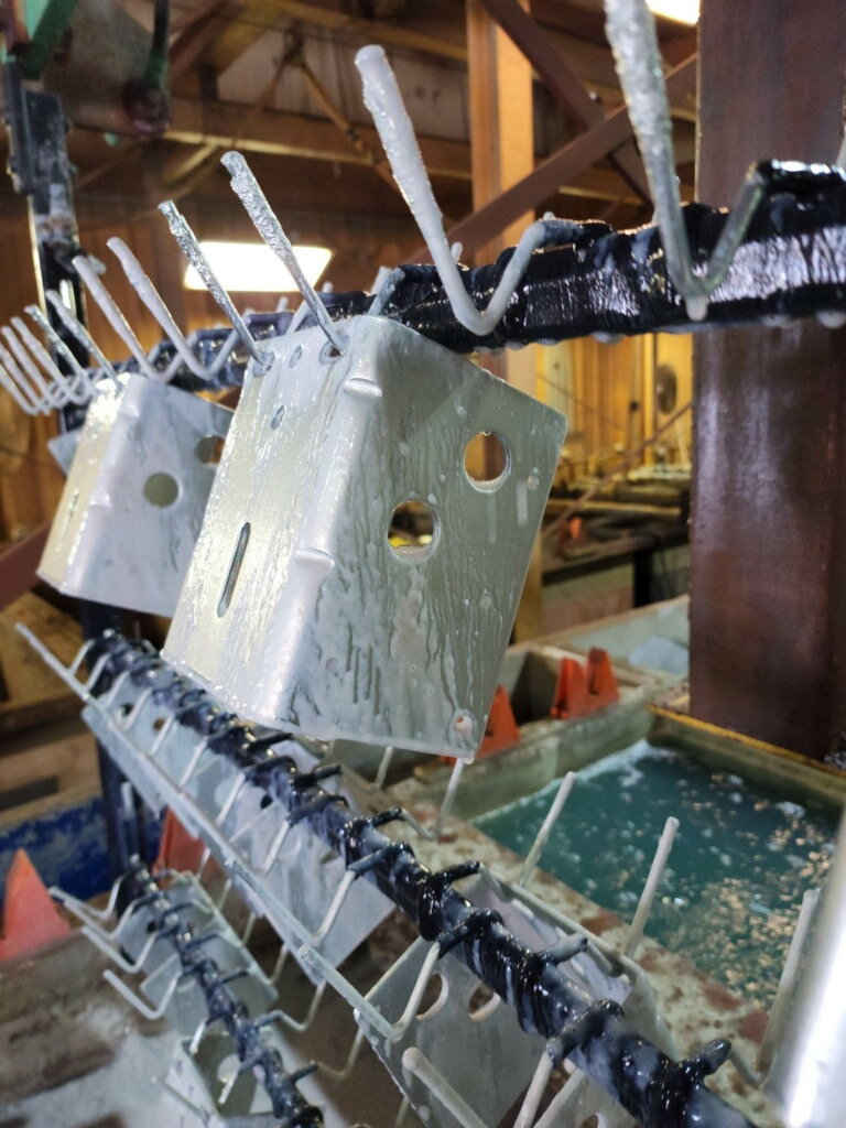Industrial filtration system filter showing white precipitated product buildup
